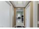 Hallway with stylish flooring leading to a bedroom with a desk and a lamp at 2747 Paradise Rd # 404, Las Vegas, NV 89109
