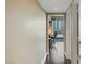 Hallway leading to a bright living area with large windows overlooking city views at 2747 Paradise Rd # 404, Las Vegas, NV 89109