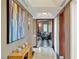 Hallway with marble floors, art, and view into the living room at 2747 Paradise Rd # 404, Las Vegas, NV 89109