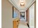 View of hallway with marble floors, art and a glimpse of the living room at 2747 Paradise Rd # 404, Las Vegas, NV 89109