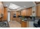 Well-appointed kitchen with granite countertops, wooden cabinets, a convenient breakfast bar, and modern appliances at 2747 Paradise Rd # 404, Las Vegas, NV 89109