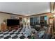 Spacious living room featuring a black and white tiled floor, media center, and terrace access at 2747 Paradise Rd # 404, Las Vegas, NV 89109