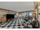 Spacious living room with checkered floors, a large television, and comfortable seating at 2747 Paradise Rd # 404, Las Vegas, NV 89109
