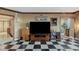 Entertainment space featuring a large-screen television and checkered tile flooring at 2747 Paradise Rd # 404, Las Vegas, NV 89109