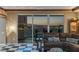 Charming living room showcasing checkered flooring, comfortable seating, and expansive city views at 2747 Paradise Rd # 404, Las Vegas, NV 89109