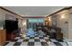 Elegant living room featuring checkered floors, a spacious seating area, and stunning cityscape views at 2747 Paradise Rd # 404, Las Vegas, NV 89109