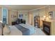 Comfortable main bedroom featuring a fireplace, desk area, and large windows at 2747 Paradise Rd # 404, Las Vegas, NV 89109