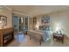 Comfortable bedroom featuring a fireplace, stylish decor, and a balcony with city views at 2747 Paradise Rd # 404, Las Vegas, NV 89109