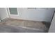 Concrete front porch area next to a white door and window at 2981 Country Manor Ln # 2, Las Vegas, NV 89115