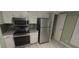 The kitchen features stainless steel appliances and lots of storage with white cabinets at 2981 Country Manor Ln # 2, Las Vegas, NV 89115