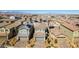 An aerial view shows many two-story homes with tile roofs and desert landscaping in a planned community at 3192 Bormida Ave, Henderson, NV 89044