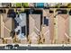 An aerial view shows desert homes with well-maintained yards, solar panels, and tile roofs in a planned community at 3192 Bormida Ave, Henderson, NV 89044