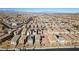 An aerial view shows desert homes with tile roofs in a large planned community set against the city skyline at 3192 Bormida Ave, Henderson, NV 89044