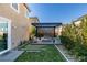 Inviting backyard with a modern pergola, comfortable seating, and lush landscaping at 3192 Bormida Ave, Henderson, NV 89044