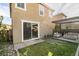 Charming backyard with a manicured lawn, pergola, and outdoor seating area at 3192 Bormida Ave, Henderson, NV 89044