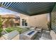Inviting backyard featuring a covered patio area with outdoor furniture at 3192 Bormida Ave, Henderson, NV 89044