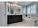 Bright bathroom featuring a soaking tub, glass shower, and double sink vanity at 3192 Bormida Ave, Henderson, NV 89044