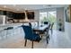 Bright dining area featuring modern table, chairs, and backyard view at 3192 Bormida Ave, Henderson, NV 89044