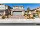 Charming two-story home featuring a well-maintained yard and a brick driveway at 3192 Bormida Ave, Henderson, NV 89044