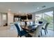 Bright kitchen with stainless steel appliances and open access to the dining area at 3192 Bormida Ave, Henderson, NV 89044