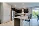 Charming kitchen featuring stainless steel appliances, a center island, and a window at 3192 Bormida Ave, Henderson, NV 89044