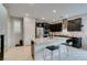 Modern kitchen featuring a center island with marble countertops and stainless steel appliances at 3192 Bormida Ave, Henderson, NV 89044