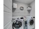 Functional laundry room with modern washer and dryer units and ample storage space at 3192 Bormida Ave, Henderson, NV 89044