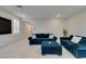 Inviting living room with blue sofas, ottoman, and neutral decor at 3192 Bormida Ave, Henderson, NV 89044