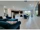 Open living space, showcasing the modern kitchen and dining area with natural lighting at 3192 Bormida Ave, Henderson, NV 89044
