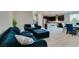 Inviting living room with open floor plan, sleek couches and access to the kitchen at 3192 Bormida Ave, Henderson, NV 89044