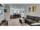 Comfortable living area with a gray sectional sofa and stylish decor at 3192 Bormida Ave, Henderson, NV 89044