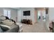 Relaxing living room area with a massage chair, neutral colors, and soft carpeting at 3192 Bormida Ave, Henderson, NV 89044