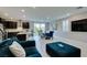 Bright living space with couches, dining table, and open access to the modern kitchen at 3192 Bormida Ave, Henderson, NV 89044