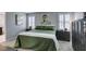 Calm decor in main bedroom featuring an artistic accent wall and large windows at 3192 Bormida Ave, Henderson, NV 89044