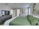 Relaxing decor in main bedroom featuring an artistic accent wall and large windows at 3192 Bormida Ave, Henderson, NV 89044