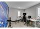 Modern home office setup with desk, chair, and fitness equipment at 3192 Bormida Ave, Henderson, NV 89044