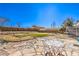 Large backyard featuring patio, grass area, and secure fencing at 3192 Taylor St, Logandale, NV 89021