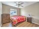 Inviting bedroom with hardwood floors, bright natural light, and ceiling fan at 3192 Taylor St, Logandale, NV 89021