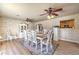 Dining room boasts neutral colors, two fans and wood look laminate flooring at 3192 Taylor St, Logandale, NV 89021