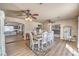 Dining room showcases wood look laminate flooring and a neutral color palette at 3192 Taylor St, Logandale, NV 89021
