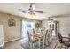 Dining room with decorative brick walls, ceiling fans, and laminate flooring at 3192 Taylor St, Logandale, NV 89021