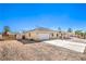 Inviting single-story home with driveway, desert landscaping, and gated side yard at 3192 Taylor St, Logandale, NV 89021