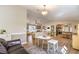 Bright living room featuring a fireplace, ceiling fan, wood flooring, and neutral decor at 3192 Taylor St, Logandale, NV 89021