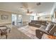 Relax in this spacious living room, with a large sectional sofa and neutral carpet at 3192 Taylor St, Logandale, NV 89021