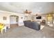 Spacious living room features plush carpet, ceiling fans, and neutral paint palette at 3192 Taylor St, Logandale, NV 89021