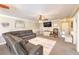 Cozy living room features a comfortable gray sofa and neutral carpeting at 3192 Taylor St, Logandale, NV 89021