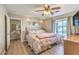Charming main bedroom offers a window view, ceiling fan, and calming neutral tones at 3192 Taylor St, Logandale, NV 89021