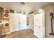 Pantry and laundry area features white cabinets, laminate floors and ample storage at 3192 Taylor St, Logandale, NV 89021