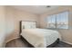 Comfortable bedroom features natural light, a queen-sized bed, and soothing neutral colors at 3411 Holly Ave, Las Vegas, NV 89106