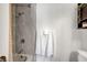 Bathroom featuring a shower and tub with modern hardware and towel rack at 3449 Lorilou Ln # 2, Las Vegas, NV 89121